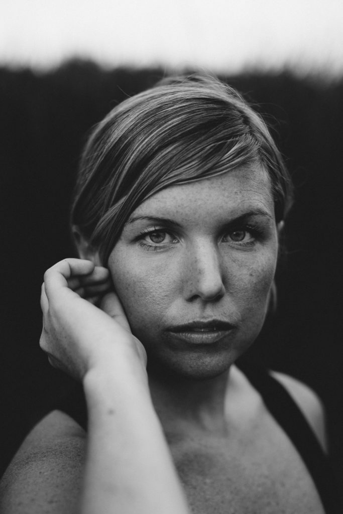Black-and-white portrait of inspiring photographer/director, Kate Rolston, who co-founded A Collective Us with her husband, Adam Bove.