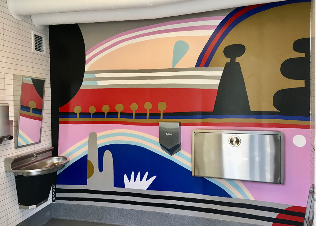 Not just a textile artist, Sarah Sullivan also paints murals for commercial businesses—like this abstract bathroom mural.